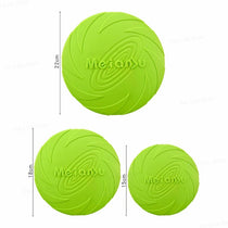 Dog playing fetch with a bite resistant flying disc toy